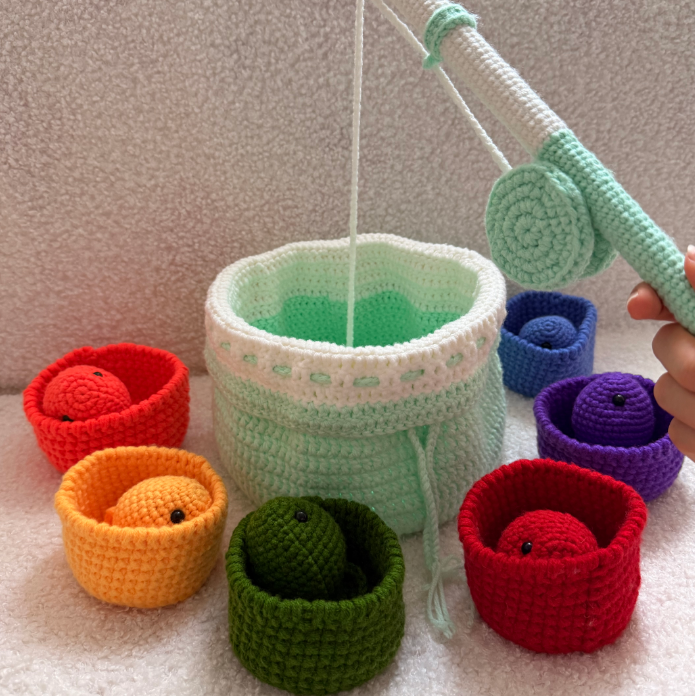 Cute crocheted marine animals in a handmade storage bag